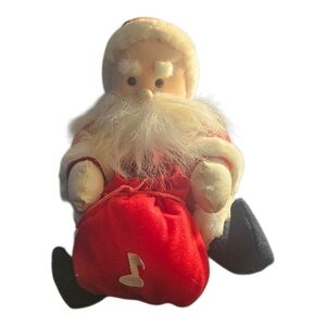 The Vintage Kids of America Plush Santa Toy Decoration is a classic holiday coll